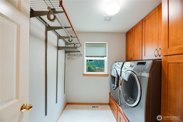 9300 138th Ct NE, Redmond, WA 98052 - clothes washing area with cabinet space, separate washer and dryer, baseboards, and visible vents