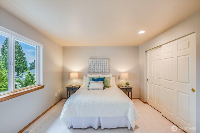 9300 138th Ct NE, Redmond, WA 98052 - bedroom with baseboards, light carpet, a closet, and recessed lighting