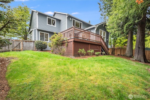 9300 138th Ct NE, Redmond, WA 98052 - back of property featuring a fenced backyard, stairs, a yard, and a deck