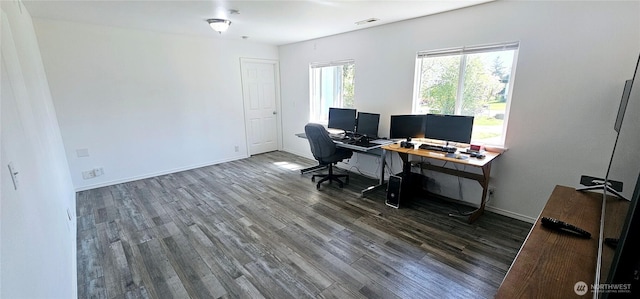 office featuring visible vents, wood finished floors, and baseboards