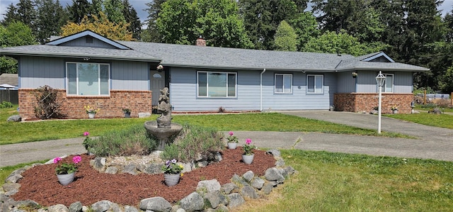 9601 128th Ave NW, Gig Harbor, WA 98329 - ranch-style home featuring a front lawn, a chimney, a shingled roof, and brick siding