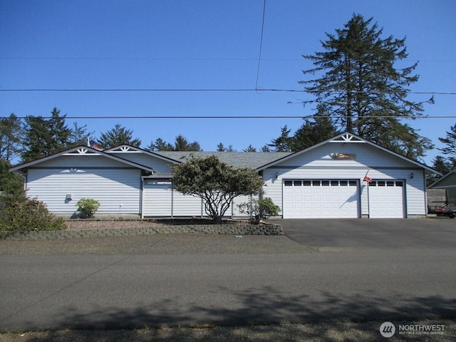 ranch-style house featuring a garage
