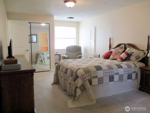 bedroom featuring light colored carpet