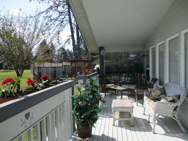 view of wooden balcony featuring outdoor lounge area and a wooden deck