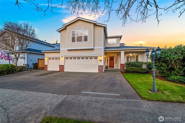 901 N Magnolia Ln, Tacoma, WA 98406 - view of front facade featuring brick siding, a garage, driveway, a lawn, and a shingled roof