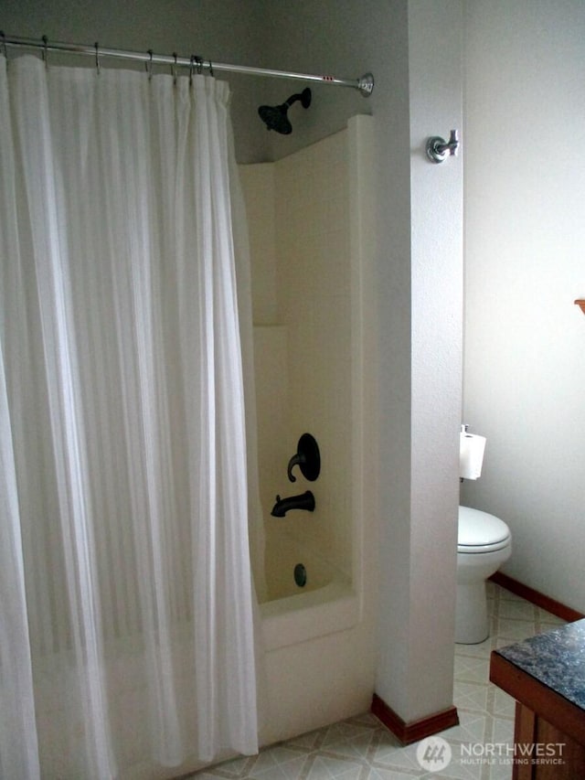 full bath with toilet, shower / bath combination with curtain, vanity, and baseboards