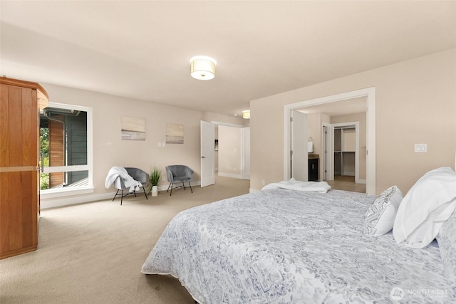 bedroom featuring baseboards and carpet