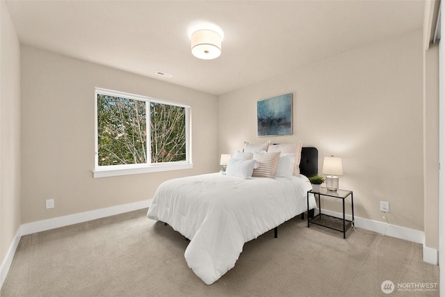 bedroom featuring baseboards, carpet, and visible vents