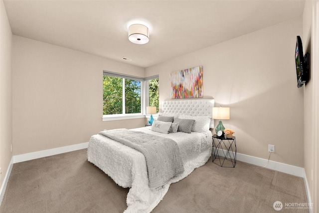 bedroom featuring carpet flooring, baseboards, and visible vents