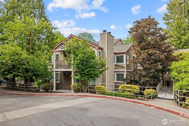 700 Front St S Unit B301, Issaquah, WA 98027 - view of front of house with a balcony and a chimney