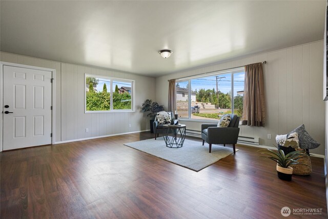 1209 Sherman Ave, Port Orchard, WA 98366 - sitting room with wood finished floors, baseboards, and a baseboard radiator