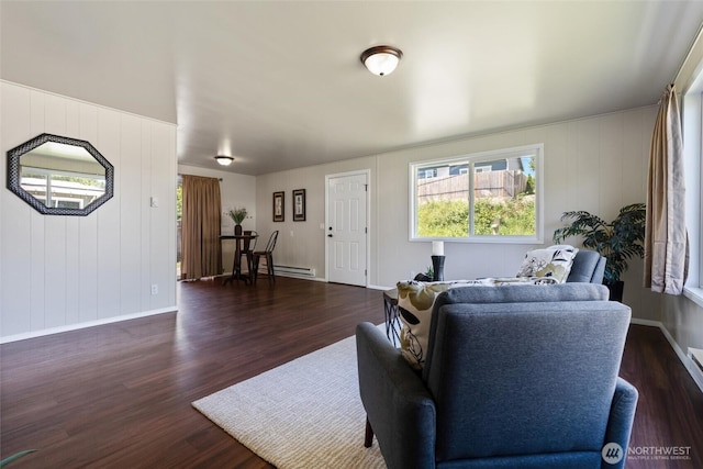 1209 Sherman Ave, Port Orchard, WA 98366 - living area with wood finished floors, plenty of natural light, and baseboard heating