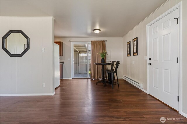 1209 Sherman Ave, Port Orchard, WA 98366 - dining space with a baseboard heating unit, baseboards, and dark wood-style flooring
