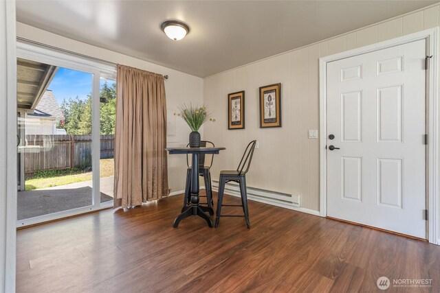 1209 Sherman Ave, Port Orchard, WA 98366 - dining space with dark wood-type flooring, a baseboard heating unit, and baseboards