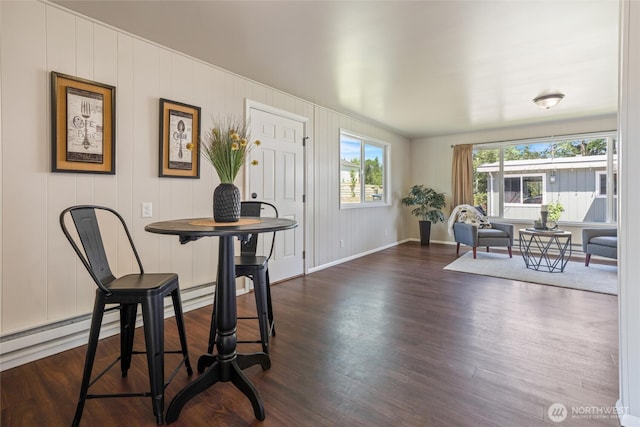 1209 Sherman Ave, Port Orchard, WA 98366 - dining area with dark wood-style floors, baseboards, and baseboard heating
