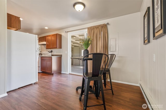 1209 Sherman Ave, Port Orchard, WA 98366 - dining room with dark wood finished floors, baseboards, a baseboard heating unit, and recessed lighting