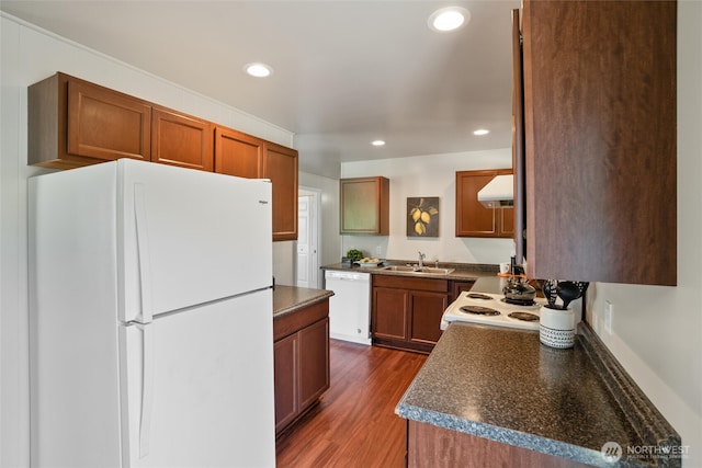 1209 Sherman Ave, Port Orchard, WA 98366 - kitchen with white appliances, a sink, under cabinet range hood, dark countertops, and recessed lighting