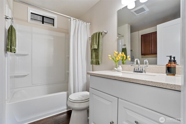 1209 Sherman Ave, Port Orchard, WA 98366 - full bathroom featuring vanity, wood finished floors, shower / tub combo with curtain, and toilet