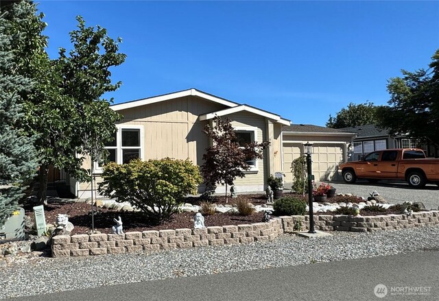 view of side of home featuring a garage