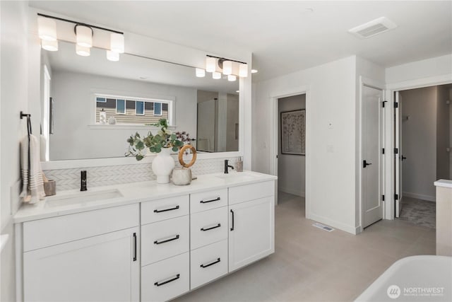 4118 220th Pl SE, Bothell, WA 98021 - full bath with double vanity, a stall shower, a freestanding bath, backsplash, and baseboards