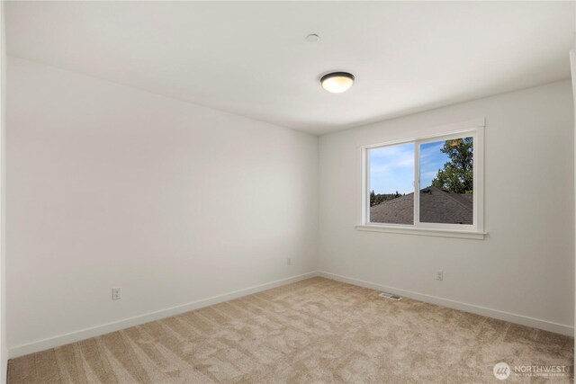 4118 220th Pl SE, Bothell, WA 98021 - spare room with light colored carpet and baseboards