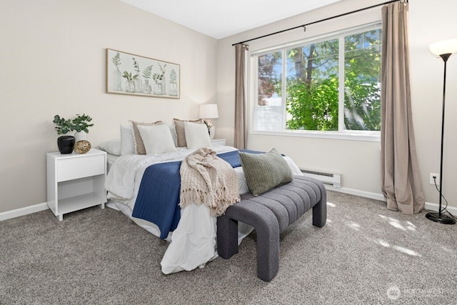 15300 112th Ave NE Unit C102, Bothell, WA 98011 - carpeted bedroom featuring a baseboard heating unit and baseboards