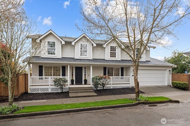 view of front of house featuring an attached garage, fence, covered porch, and concrete driveway