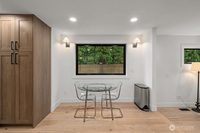 dining area featuring light wood-style floors, recessed lighting, and a wealth of natural light