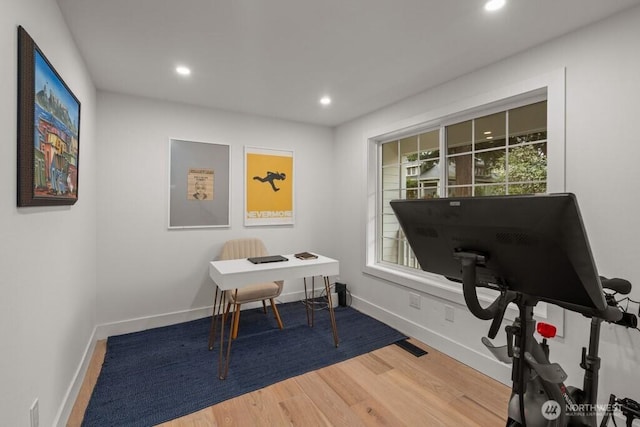 office space with recessed lighting, visible vents, baseboards, and wood finished floors