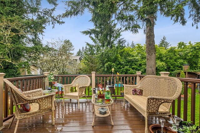 wooden deck featuring outdoor lounge area