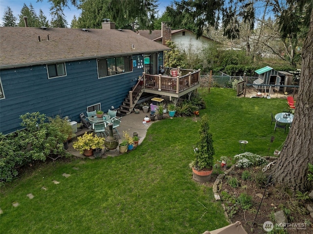 exterior space with a patio area, a fenced backyard, stairway, and a deck