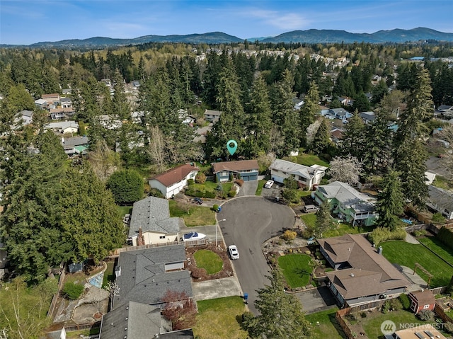 aerial view with a residential view, a forest view, and a mountain view