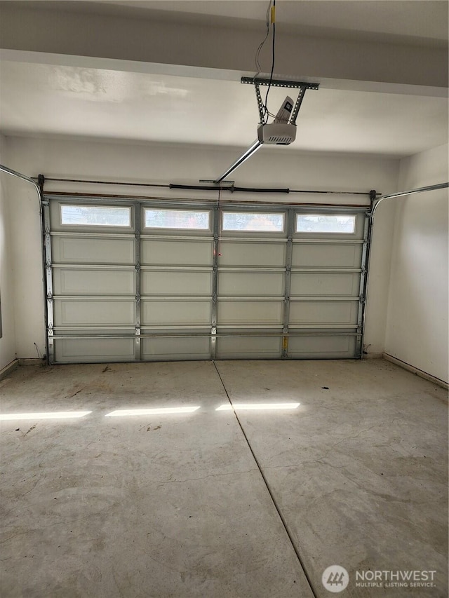 garage featuring a garage door opener