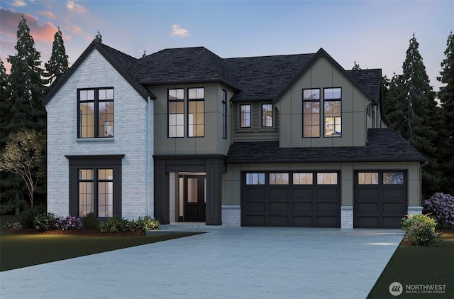 view of front facade featuring an attached garage, a shingled roof, concrete driveway, and brick siding