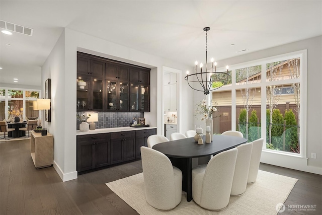 dining area with visible vents, a chandelier, baseboards, recessed lighting, and dark wood-style floors