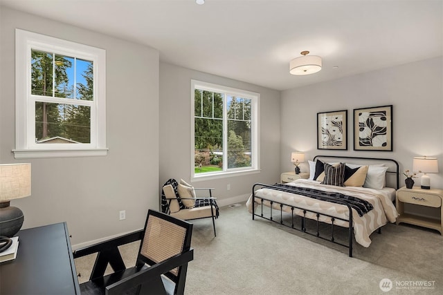 carpeted bedroom with baseboards