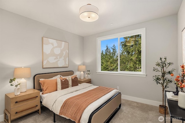 carpeted bedroom featuring baseboards