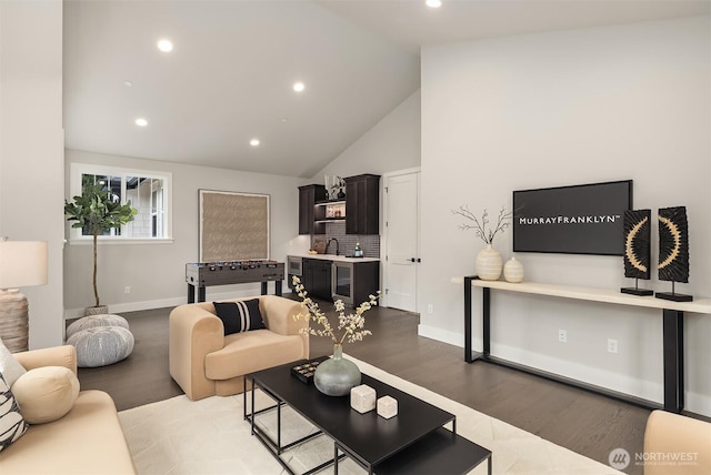 living area featuring baseboards, beverage cooler, light wood-style floors, and recessed lighting