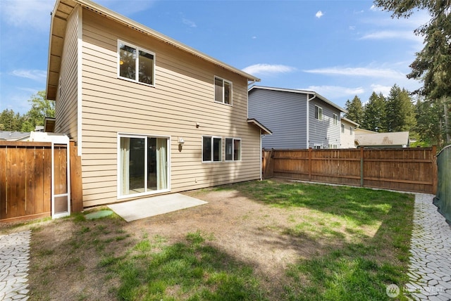 back of house with a patio