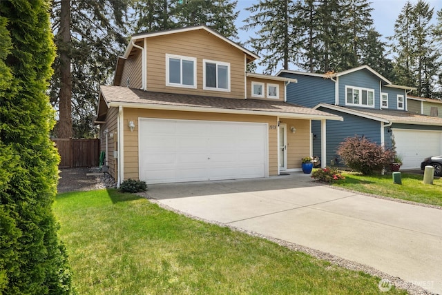 traditional-style house with a garage and concrete driveway