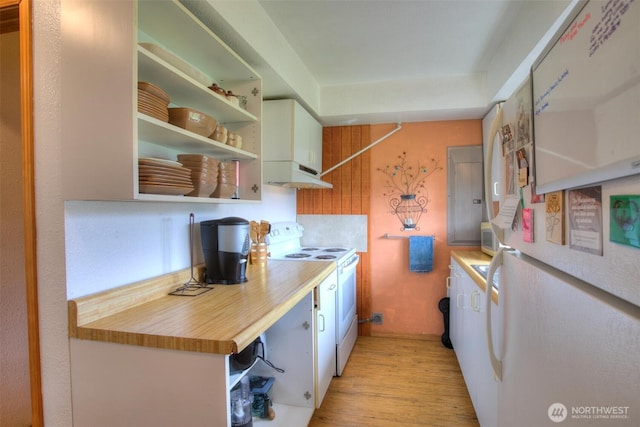 2691 State Route 109, Ocean City, WA 98569 - kitchen featuring open shelves, light wood-style flooring, white appliances, light countertops, and under cabinet range hood