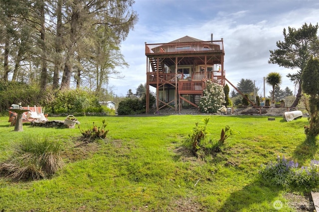 2691 State Route 109, Ocean City, WA 98569 - rear view of property with a wooden deck, a yard, and stairs