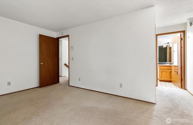 1282 Lanyard Loop Unit 1, Oak Harbor, WA 98277 - empty room with light colored carpet and a textured ceiling