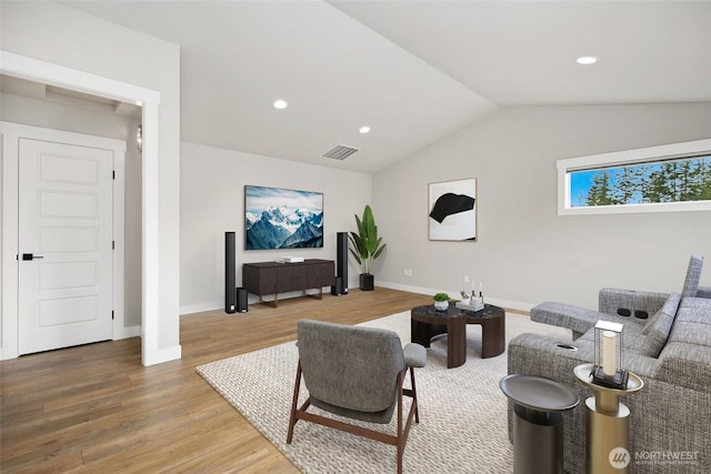 living area with light wood-style flooring, lofted ceiling, baseboards, and recessed lighting