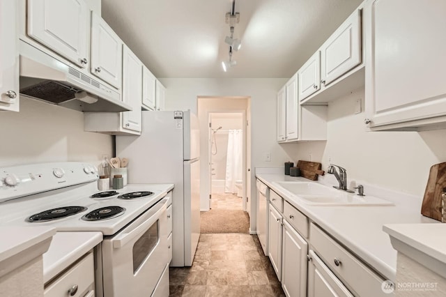 105 S 340th St Unit G, Federal Way, WA 98023 - kitchen featuring white appliances, under cabinet range hood, a sink, and white cabinetry