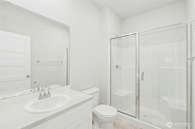 27113 30th Pl S Unit 23, Kent, WA 98032 - bathroom featuring a shower stall, toilet, vanity, and tile patterned flooring