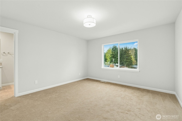 27113 30th Pl S Unit 23, Kent, WA 98032 - empty room featuring light carpet and baseboards