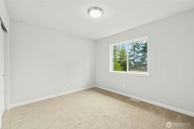 27113 30th Pl S Unit 23, Kent, WA 98032 - unfurnished bedroom with light carpet, baseboards, and a closet