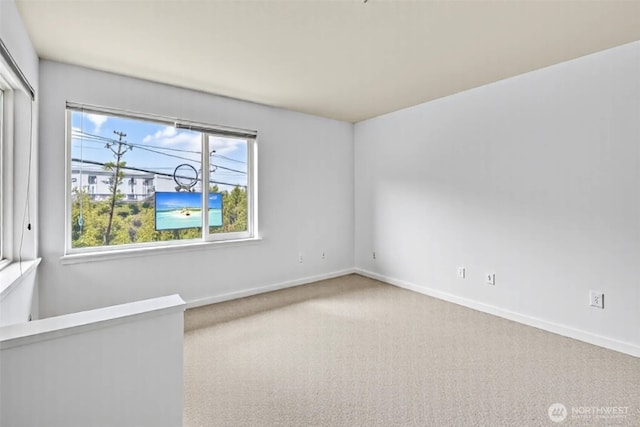 500 Elliott Ave W Unit 309, Seattle, WA 98119 - carpeted empty room with baseboards