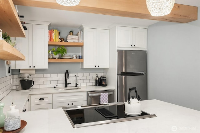 756 N 72nd St Unit 101, Seattle, WA 98103 - kitchen with a sink, freestanding refrigerator, open shelves, and dishwasher